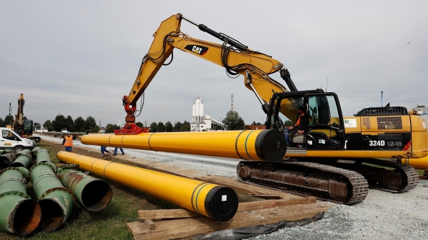 BRUNSBUETTEL, GERMANY - SEPTEMBER 23: Pipeline pipes are offloaded at the construction site of a new liquified natural gas (LNG) terminal on September 23, 2022 near Brunsbuettel, Germany. The terminal, which will allow the import of natural gas from ships transporting the gas in its liquified form (LNG), is the second Germany is currently building in an effort to offset diminished gas imports from Russia. (Photo by Morris MacMatzen/Getty Images)
