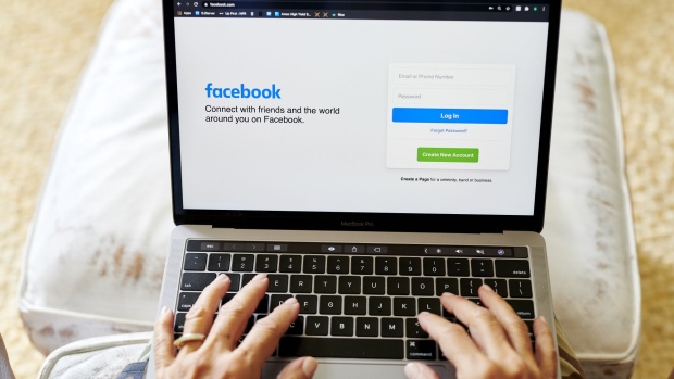 The website home screen for Facebook is displayed on a laptop computer in an arranged photograph taken in Little Falls, New Jersey, U.S., on Thursday, Oct. 8, 2020. Facebook Inc. is tightening its rules on content concerning the U.S. presidential election next month, including instituting a temporary ban on political ads when voting ends, as it braces for a contentious night that may not end with a definitive winner. Photographer: Gabby Jones/Bloomberg