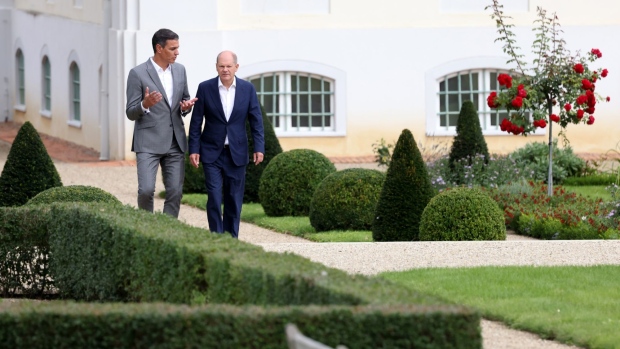 Pedro Sanchez, Spain's prime minister, left, and Olaf Scholz, Germany's chancellor, during a walk in the garden at Meseberg Castle in Meseberg, Germany, on Monday, Aug. 30, 2022. Europe's energy crisis is high on the agenda for Scholz and Sanchez in Meseberg.