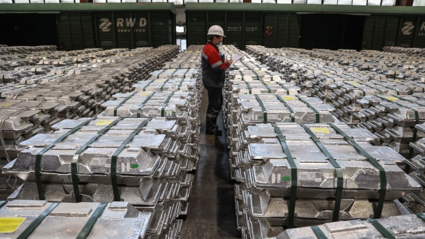 A worker inspects bound stacks of aluminium ingots ready for shipping in the foundry at the Sayanogorsk Aluminium Smelter, operated by United Co. Rusal, in Sayanogorsk, Russia, on Wednesday, May 26, 2021. United Co. Rusal International PJSC’s parent said the company has produced aluminum with the lowest carbon footprint as the race for cleaner sources of the metal intensifies.