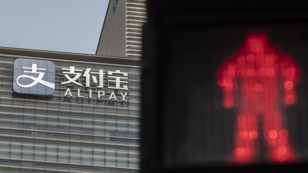 An Alipay sign at an Ant Group Co. office building in Shanghai, China, on Thursday, July 28, 2022. Billionaire Jack Ma plans to relinquish control of Ant Group, Dow Jones reported, citing people familiar with the matter said, part of the fintech giant’s effort to appease regulators following a lengthy crackdown. Photographer: Qilai Shen/Bloomberg