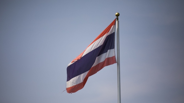A Thai flag flies in Khon Kaen, Thailand, on Friday, March 8, 2019. Thaksin Shinawatra hasn’t set foot in Thailand since he was convicted in a corruption case brought after a 2006 coup that deposed him. But in the poor northeast the billionaire former prime minister’s allies have won won every election since 2001. The March 24 election will again test whether Thailand’s rural masses repudiate its coup-prone generals, who’ve ruled the country since seizing power in 2014. Photographer: Brent Lewin/Bloomberg