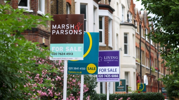 Estate agent "For Sale" signs outside residential properties in the Queen's Park district of London, UK, on Thursday, June 30, 2022. UK house prices slowed more than expected this month after a series of interest-rate increases raised the cost of mortgages. Photographer: Hollie Adams/Bloomberg