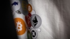 Bitcoin and Ethereum logos on a t-shirt on display inside a cryptocurrency exchange in Barcelona, Spain, on Thursday, Sept. 8, 2022. The upcoming 'merge' will be the Ethereum blockchain's most ambitious software upgrade ever, with the upgrade representing a fundamental overhaul of how the Ethereum blockchain works. Photographer: Angel Garcia/Bloomberg