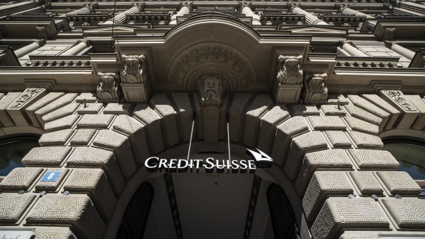 A sign hangs above an entrance to the Credit Suisse Group AG headquarters in Zurich, Switzerland, on Wednesday, Oct. 5, 2022. Credit Suisse has become a poaching ground for rivals in recent times, with the lender struggling to contain the fallout of a series of scandals and flagging performance. Photographer: Jose Cendon/Bloomberg
