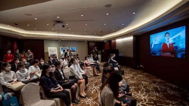 An applicant during a Cathay Pacific Airways Ltd. flight attendant recruitment event in Hong Kong, China, on Friday, Oct. 7, 2022. Just over 1,000 people have signed up for Cathay's flight attendant recruiting drive, around half of the 2,000 targeted by the end of 2023, underscoring the labor challenges the airline faces as it seeks to to fully restore flights in and out of the Asian financial hub.