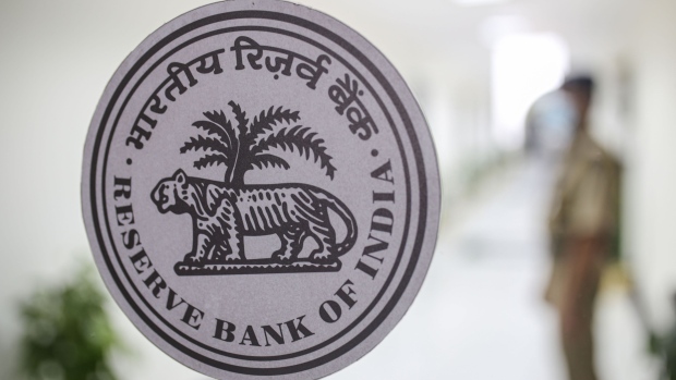 The Reserve Bank of India (RBI) logo displayed inside bank's headquarters in Mumbai, India, on Friday, Sep. 30, 2022. India’s central bank delivered a hat-trick of half-point interest-rate hikes, sustaining its battle to rein in inflation while flagging “calibrated action” to shield the economy amid fears of a global recession. Photographer: Dhiraj Singh/Bloomberg