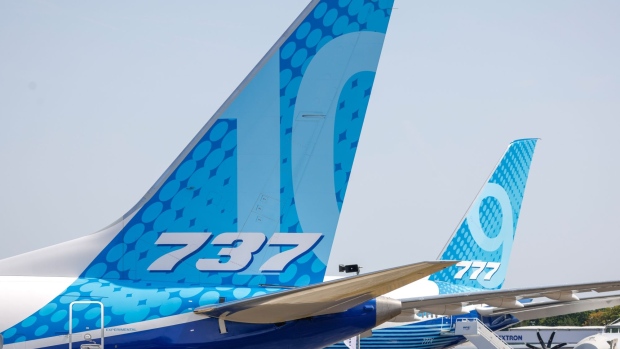 The tailfins of a Boeing 737 Max 10 and a Boeing 777-9 aircraft on the opening day of the Farnborough International Airshow in Farnborough, UK, on Monday, July 18, 2022. The airshow, one of the biggest events in the global aerospace industry, runs through July 22. Photographer: Jason Alden/Bloomberg