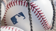  A baseball with MLB logo.