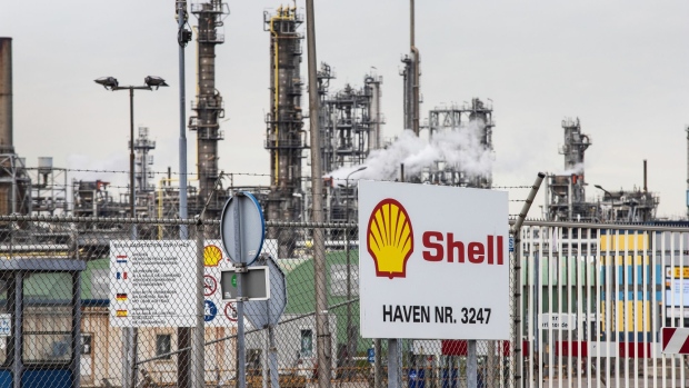 A Royal Dutch Shell Plc logo on a fence at the Shell Pernis refinery in Rotterdam, Netherlands, on Tuesday, April 27, 2021. Shell reports first quarter earnings on April 29. Photographer: Peter Boer/Bloomberg