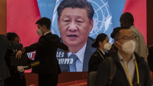 BEIJING, CHINA -OCTOBER 15: A video screen shows Chinese President Xi Jinping as security check visitors at the press centre for the 20th National Congress of the Communist Party of China in a closed loop hotel to prevent the spread of COVID-19 on October 15, 2022 in Beijing, China. The ruling Communist Party of China will open its 20th Party Congress on October 16th and Xi Jinping is widely expected to secure a third term in power. (Photo by Kevin Frayer/Getty Images)