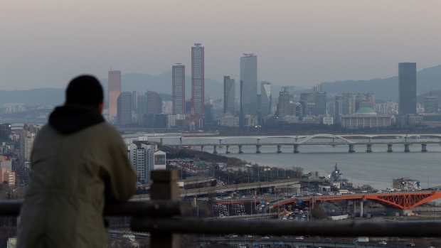 A view of the Yeouido financial district at dusk in Seoul, South Korea, on Thursday, March 3, 2022. South Korea kicked off two days of early voting on March 4 as the country battles a record wave of coronavirus infections, while data showed inflation unexpectedly accelerated in February as rising costs weighed on voters. Photographer: SeongJoon Cho/Bloomberg