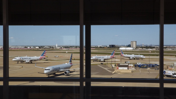 American Airlines planes sit on the tarmac at Dallas/Fort Worth International Airport (DFW) in Dallas, Texas, U.S., on Monday, Sept. 28, 2020. Airline passenger numbers in the U.S. totaled 797,699 on Sept. 28, compared with 2.37 million the same weekday a year earlier, according to the Transportation Security Administration. Photographer: Angus Mordant/Bloomberg
