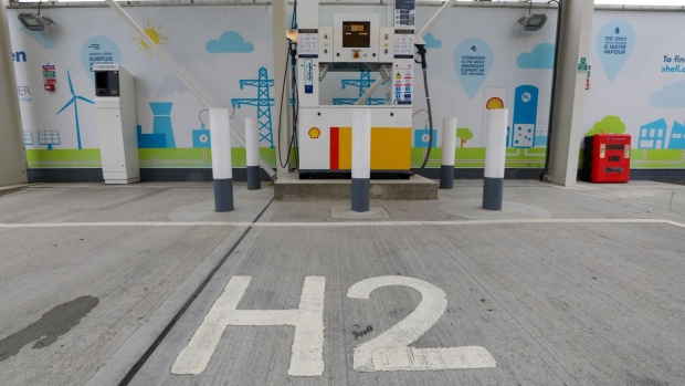 A H2 logo sits at a hydrogen charging pump at a Royal Dutch Shell Plc petrol filling station in Cobham, U.K., on Wednesday, Sept. 30, 2020. Royal Dutch Shell Plc will cut as many as 9,000 jobs as Covid-19 accelerates a company-wide restructuring into low-carbon energy.