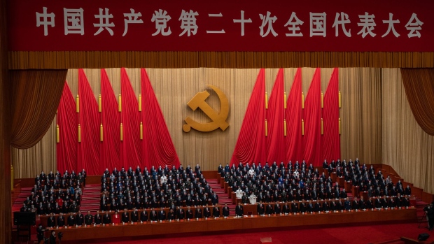 Delegates stand during the closing session of the 20th National Congress of the Chinese Communist Party at the Great Hall of the People in Beijing, China, on Saturday, Oct. 22, 2022. President Xi Jinping is officially set for a third term surrounded by allies, after key Communist Party officials without close ties to the Chinese leader exited the nation’s top leadership body.