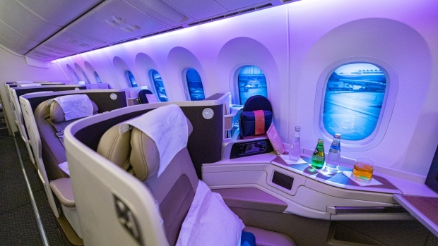 Seats for business class passengers aboard a Boeing 787-10 passenger aircraft, operated by Saudia Airlines, at the 17th Dubai Air Show (DAS) in Dubai, United Arab Emirates, on Monday, Nov. 15, 2021. On the first day of the Airshow, that will run through November 18, Emirates President Tim Clark said the Gulf carrier could look at accelerating deliveries of Airbus SE A350 jets if Boeing Co. fails to pin down delivery dates for the rival 777X model.