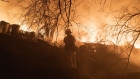 Firefighters battle flames after a structure burned during the Fairview Fire in Hemet, California, US, on Monday, Sept. 5, 2022. Firefighters in Riverside County battled a rapidly spreading brush fire in Hemet Monday that destroyed several homes and forced the evacuation of many others in the southeast part of the city, reported KTLA.