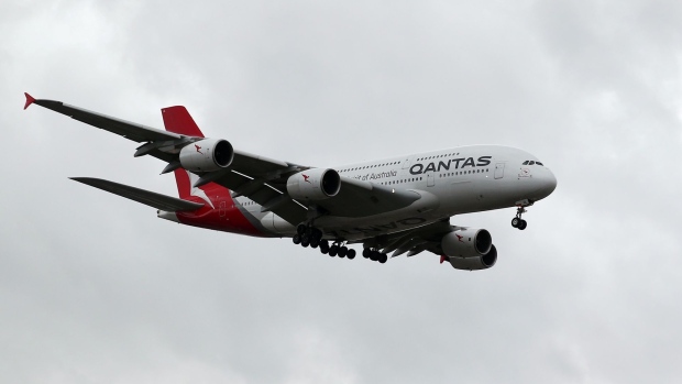 An Airbus SE A380 aircraft operated by Qantas Airways Ltd. approaches to land at Sydney Airport in Sydney, Australia, on Thursday, Feb. 21, 2019. Qantas' international business is bearing the brunt of higher fuel costs, which are shredding the division's profit margin.