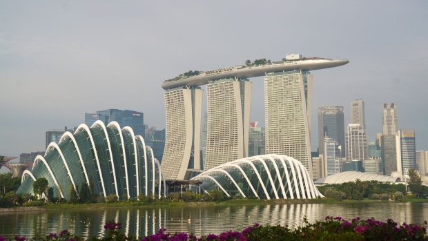 Gardens by the Bay, from left, Marina Bay Sands, and the central business district in Singapore, on Sunday, Oct. 3, 2021. Singapore is looking to launch new vaccinated travel lanes by the end of the year and is in negotiations with several countries including those in Europe and also the U.S., Trade Minister Gan Kim Yong said, signaling continued caution even as other advanced economies open up. Photographer: Ore Huiying/Bloomberg