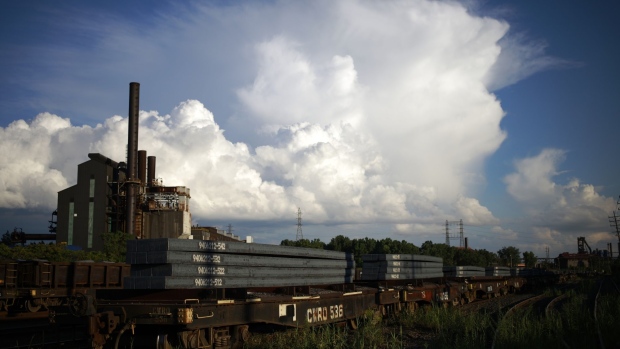 A fright train carries steel at the Cleveland-Cliffs Inc. Cleveland Works steel mill in Cleveland, Ohio, US, on Wednesday, Aug. 17, 2022. US steel may be showing the first inkling of a slowdown in demand as construction-sector demand softens, according to Cleveland Cliffs Inc., the nation's second-largest steelmaker.