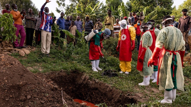 A prayer is read during a burial of an Ebola victim in Mubende, Uganda, on Oct.11, 2022.