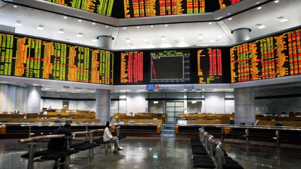 Stock prices displayed inside the trading gallery of the RHB Investment Bank Bhd. headquarters in Kuala Lumpur, Malaysia, on Tuesday, Oct. 11, 2022. Malaysia’s stocks and the ringgit weakened after Prime Minister Ismail Sabri Yaakob announced the dissolution of parliament on Monday, paving the way for elections this year.