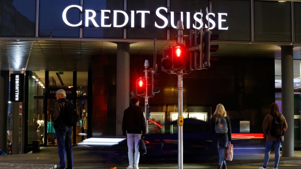 Red pedestrian crossing signs outside a Credit Suisse Group AG bank branch in Basel, Switzerland, on Tuesday, Oct. 25, 2022. Credit Suisse will present its third quarter earnings and strategy review on Oct. 27. Photographer: Stefan Wermuth/Bloomberg