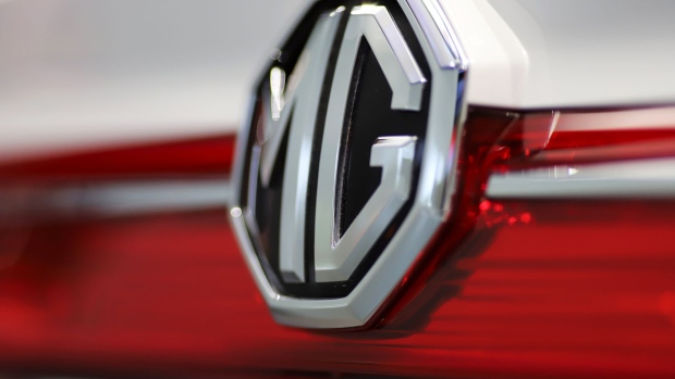 An MG badge is displayed on an MG Hector sports utility vehicle (SUV) during the vehicle's launch at the Morris Garages flagship showroom in Gurugram, Haryana, India, on Thursday, June 27, 2019. The launch of the Hector from the iconic brand MG, now owned by Chinese giant SAIC Motor Corp., marks the first Chinese entrant in a notoriously difficult market where the likes of General Motors Co. and Ford Motor Co. have struggled.