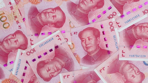 Chinese one-hundred yuan banknotes are arranged for a photograph in Hong Kong, China, on Thursday, April 23, 2020.  Photographer: Paul Yeung/Bloomberg