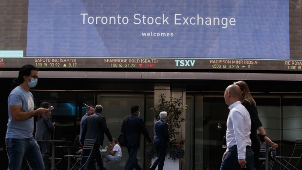 Pedestrians pass in front of the Toronto Stock Exchange in the financial district of Toronto, Ontario, Canada, on Thursday, Sept 16, 2021. Oil jumped to the highest in six weeks amid signs of a rapidly tightening market after a U.S. government report showed a bigger-than-expected decline in crude stockpiles. Photographer: Cole Burston/Bloomberg