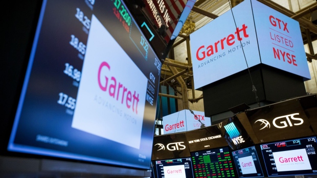 A monitor displays Garrett Motion Inc. signage on the floor of the New York Stock Exchange (NYSE) in New York, U.S., on Monday, Oct. 1, 2018. U.S. stocks rose toward records, while the Canadian dollar and Mexican peso gained after negotiators agreed to a new version of the Nafta trade pact.