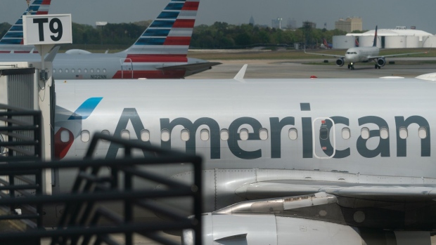 American Airlines Group Inc. planes parked at gates at Hartsfield-Jackson Atlanta International Airport in Atlanta, Georgia, U.S., on Wednesday, April 7, 2021. U.S. airlines are bringing back more pilots as they prepare for an expected travel rebound.