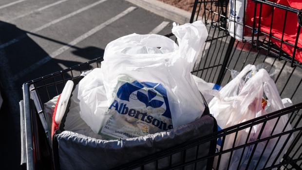 A shopping cart with grocery bags outside an Albertsons supermarket in Las Vegas, Nevada, U.S., on Friday, Jan. 7, 2022. Albertsons Cos is scheduled to release earnings figures on January 11.