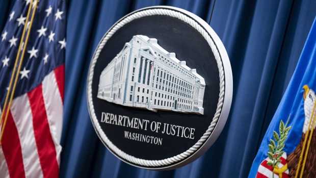The seal of the Department of Justice in Washington, DC, US, on Monday, Oct. 24, 2022. 13 individuals have been charged, including members of the People's Republic of China (PRC), for alleged efforts to unlawfully exert influence in the United States for the benefit of the government of the PRC, according to the Justice Department.