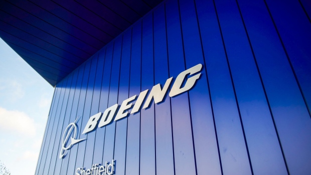 The Boeing Co. logo hangs from an entrance to its factory in Sheffield, U.K., on Thursday, Oct. 25, 2018. The U.S. planemaker opened its first European factory, a 40 million-pound ($52 million) facility that will make system-control components used for 737 and 737 Max narrowbody and 767 widebody jets. Photographer: Matthew Lloyd/Bloomberg