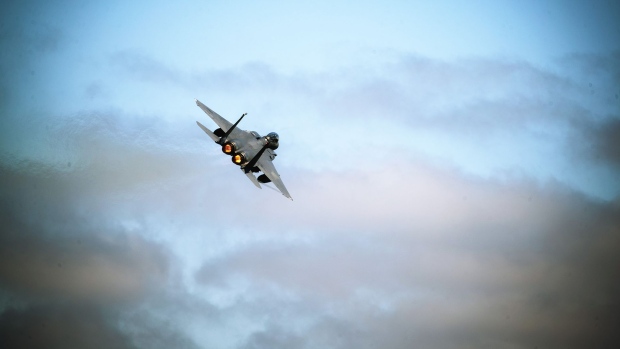 A Boeing F15-E Strike Eagle combat aircraft takes off from the airbase as the 48th Fighter Wing of the United States Air Force participates in 'Point Blank', a joint exercise with NATO allies from their American base at Royal Air Force Lakenheath, near Brandon, Suffolk, U.K. Photographer: Simon Dawson/Bloomberg