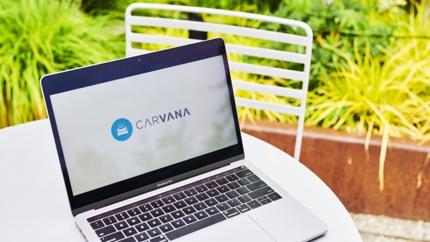 The logo for Carvana Co. is displayed on a laptop computer in an arranged photograph taken in the Brooklyn borough of New York, U.S., on Thursday, June 11, 2020. When it debuted in 2013, Carvana leapfrogged the franchised dealer by allowing consumers to buy cars online, which forced franchised dealers to elevate service and allow customers to complete transactions in any number of ways. Photographer: Gabby Jones/Bloomberg