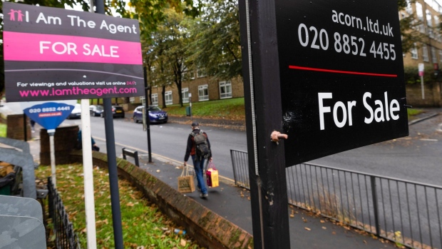 For sale signs outside residential properties in London, UK, on Thursday, Oct. 13, 2022. UK estate agents turned pessimistic about the housing market, anticipating prices will decline over the next year for the first time since the start of the coronavirus pandemic. Photographer: Chris Ratcliffe/Bloomberg