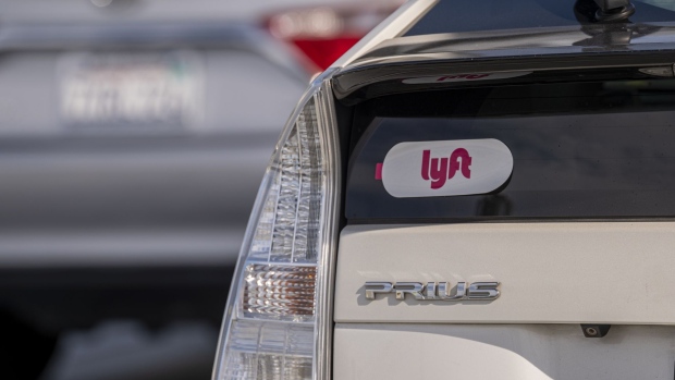 Lyft signage on a vehicle as it exits the ride-sharing pickup at San Francisco International Airport in San Francisco, California, U.S., on Thursday, Feb. 3, 2022. Lyft Inc. is scheduled to release earnings figures on February 8.