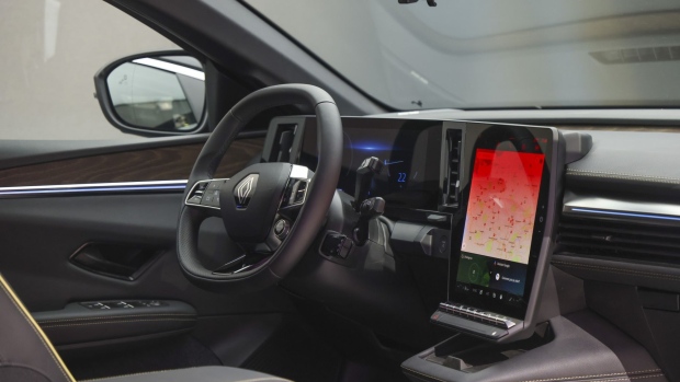 The computer display and driver's console inside a Renault Megane E-Tech electric vehicle (EV) at the IAA Munich Motor Show in Munich, Germany, on Monday, Sept. 6, 2021. The IAA, taking place in Munich for the first time, is the first in-person major European car show since the Coronavirus pandemic started.