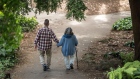 A elderly couple holds hands while walking on a path at Golden Gate Park in San Francisco, California, U.S., on Thursday, June 21, 2018. The Labor Department rule, aka the fiduciary rule conceived by the Obama administration, was meant to ensure that advisers put their clients' financial interests ahead of their own when recommending retirement investments has been killed by the Trump administration. Photographer: Bloomberg/Bloomberg