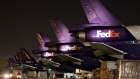 FedEx aircraft sit on the tarmac at the FedEx Express hub at Memphis International Airport in Memphis, Tennessee. 