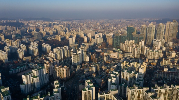Commercial and residential buildings stand in this aerial photograph taken above Seoul, South Korea, on Saturday, Jan. 18, 2020. The South Korean government has launched a raft of property-related measures since taking office in 2017, with the latest in December dubbed “draconian” by CLSA. While the steps have yet to reel in all the pockets of price gains, some economists say they are contributing to a construction slump that was the main drag on economic growth in the third quarter. Photographer: SeongJoon Cho/Bloomberg