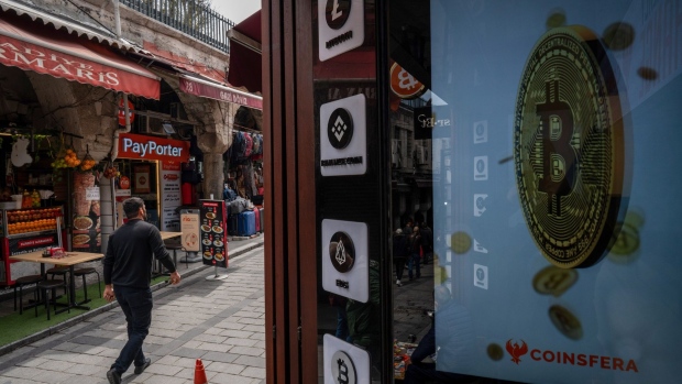 Cryptocurrency logo signs outside a crypto exchange kiosk in Istanbul, Turkey, on Friday, April 21. 2022. Turkish inflation soared to a fresh two-decade high in March, leaving the lira increasingly vulnerable by depriving the currency of a buffer against market selloffs. Photographer: Erhan Demirtas/Bloomberg