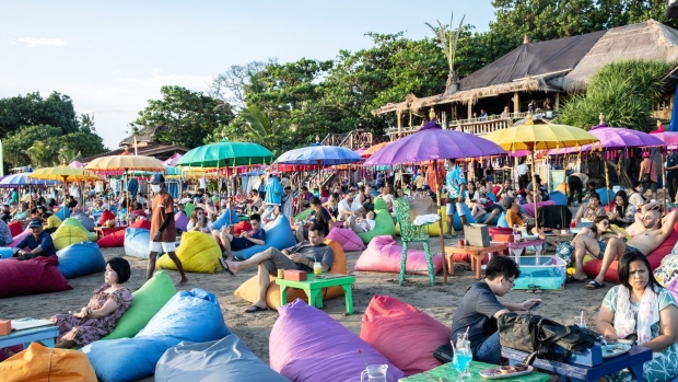 Visitors at the Jimbaran Beach in Bali, Indonesia, on Thursday, Nov. 10, 2022. The G20 summit, which will be held Nov. 15-16 at Nusa Dua, is expected to contribute as much as 7.4 trillion rupiah ($472 million) to the economy, according to the government. Photographer: Putu Sayoga/Bloomberg