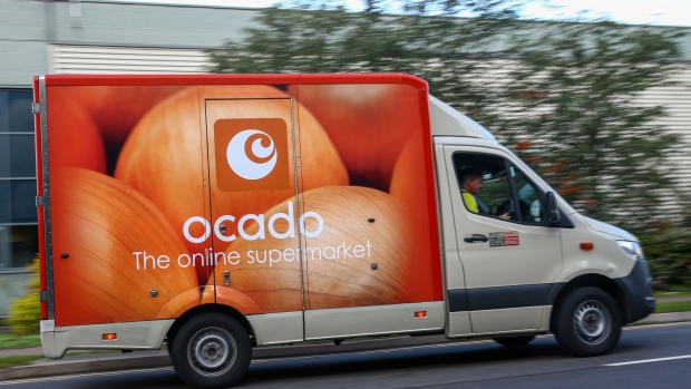 A grocery delivery truck operated by an Ocado Group Plc departs from a fulfillment centre in Enfield, U.K., on Wednesday, Sept. 30, 2020. Covid-19 lockdown enabled online and app-based grocery delivery service providers to make inroads with customers they had previously struggled to recruit, according the Consumer Radar report by BloombergNEF. Photographer: Hollie Adams/Bloomberg