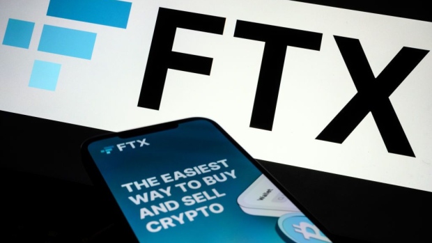LONDON, ENGLAND - NOVEMBER 10: In this photo illustration the FTX logo and mobile app adverts are displayed on screens on November 10, 2022 in London, England. The Bahamas-based crypto exchange's larger rival, Binance, walked away from a potential bailout deal, as FTX struggles with a wave of customer withdrawals that have created a liquidity crunch. (Photo Illustration by Leon Neal/Getty Images) Photographer: Leon Neal/Getty Images Europe