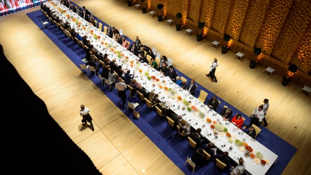 G20 leaders attend a state banquet in Hamburg in 2017. Germany reportedly served Vladimir Putin, Xi Jinping and other leaders smoked catfish with cold sorrel soup, chicken fricassee and fried crayfish with black rice. Photographer: Michael Ukas/Pool/Getty Images