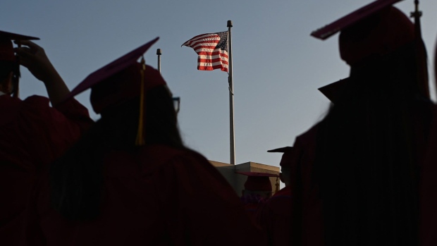 Students graduate in Pasadena, California. Photographer: Robyn Beck/AFP/Getty Images