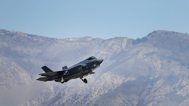 A Lockheed Martin Corp. F-35A jet flies during a training mission in Hill Air Force Base, Utah, U.S., on Friday, Oct. 21, 2016.  Photographer: George Frey/Bloomberg